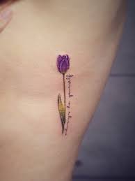 Small Purple Tulip Flower Tattoo On Side Rib Tulip Tattoo Purple Flower Tattoos Tattoos