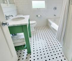 White, blue, and gray mosaic floor tiles are fitted in a long bathroom and lead to a seamless glass shower boasting a marble threshold, marble mosaic floor. 15 Bathrooms With Amazing Tile Flooring