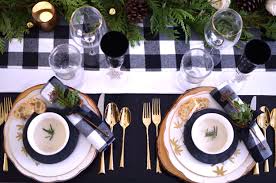 Black And White Buffalo Plaid Table Decor Rustic Holiday Black And White Buffalo Plaid Table Setting With Green And Wooden Charger Plates Shot By Th Rustic Holiday Holiday Tables Christmas Eve Table
