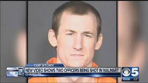 Dramatic moment two hero cops shoot dead gunman in US supermarket despite  being shot several times in the face and arm