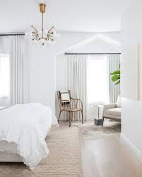 white bohemian bedroom with layered rugs and bedding by calgary interior design white bo bedroom inspirations master bedroom makeover finished living room