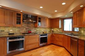 Omega Inset Cabinets In A Cerused Pecan Finish Fusion Quartzite Countertops Multi Colored Slate Backsplash Brick Floor Kitchen Kitchen Kitchen Plans