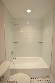 Oversized Tub Shower Combo With Light Blue Tile Shower Shelves And Large Rainfall Shower Head Tub Shower Combo Shower Tub Tub Remodel