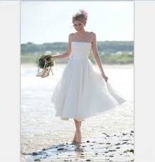The model has her left hand on a strap which appears to be detachable. 2021 Summer Short Beach A Line Wedding Dress Vintage 1950 Tea Length Wedding Gowns Backless Strapless Vestidos De Novia Wedding Dresses Aliexpress