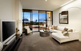 Furniture pushed up against a wall in a narrow living room emphasizes the length of the space. How To Furnish A Rectangular Room Realestate Com Au