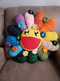 He works in fine arts media (such as painting and sculpture) as well as commercial media (such as fashion, merchandise, and animation) and is known for blurring the line between high and low arts. Crocheted Pillow Inspired By Takashi Murakami Flowers Crafts