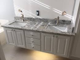 With its snowy shine and dark veining, white ice granite is a refreshing choice for kitchen and bathroom countertops alike. White Ice Granite Bathroom Countertop The Granite Place ÙÙŠØ³Ø¨ÙˆÙƒ