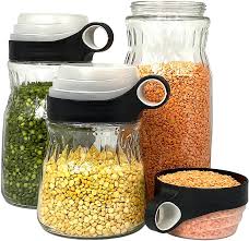 Designed with a natural bamboo lid with the silicone seal, these multipurpose canisters provide airtight protection for both dried items such as pasta and spices, along with being hot/cold resistant to store liquids and everything in between. Buy Elfin Glass Kitchen Canisters With Measuring Cup Lids 33 8 50 7 67 6oz Glass Food Storage Jars Clear Glass Canister Set Of 3 Online In Poland B07xdtylfd