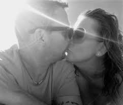 Hello. This is me and my fiancé. He passed away last month, and I'd be  really grateful if some clever person here could remove the sunstreaks and  just make it look as