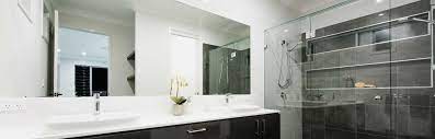 Mirrors are a focal point of a bathroom's decor. Bathroom Mirrors Framed Frameless Bradnam S Windows Doors