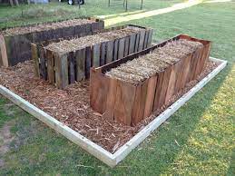 Trying Straw Bale Garden This Year Built Some Pretty Frames Around Them Using Salvaged Privacy Fen Straw Bale Gardening Strawbale Gardening Hay Bale Gardening
