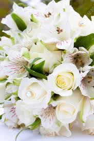 Download the perfect bouquet of flowers pictures. A White Flower Bouquet At A Wedding Ceremony With Jewels In The Stock Photo Picture And Royalty Free Image Image 16606462