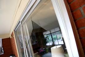 Broken glass on sliding patio door. Mobile Screen And Glass