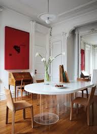 Tall windows and sleek kitchens and bathrooms make the curve the apartment of choice. Ahead Of The Curve In De Cardenass Dining Room A Paul Rudolph Table And Mar Apartment Interior Dining Room Design Brooklyn Apartment Interior