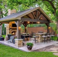 With such designs, you can enjoy a fireplace under the roof while it's raining outside. 10 Captivating Patio Ideas For A Stunning Backyard