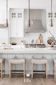 This Two Tone Modern Farmhouse Kitchen Features Ella Countertops Glass Pendant Lights And A Farmhouse Kitchen Design Kitchen Design Modern Farmhouse Kitchens