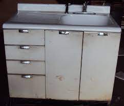 What was the color of steel kitchen cabinets? Vintage Kitchen Sink Cabinet Enamel Steel W Drawers Vintage Kitchen Sink Metal Kitchen Cabinets Kitchen Cabinet Inspiration