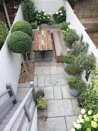 Find landscaping and garden ideas, including water features, fences, gates, flowers and plants. Fulham Slim Subtle Garden Club London Small Backyard Landscaping Small Courtyard Gardens Contemporary Garden Design