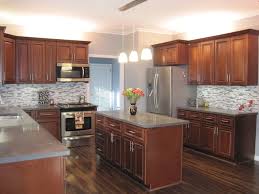 In the past, stained natural wood cabinets dominated every kitchen. 2010 Finalist On Cg Dark Cherry Cabinets With Dark Wood Flooring And Cool Colored Glass Tiles For B Cherry Cabinets Kitchen Kitchen Remodel Blue Kitchen Walls