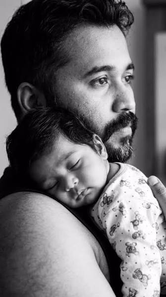 Black & White Father & Sleeping Newborn Shoulder Hug Portrait