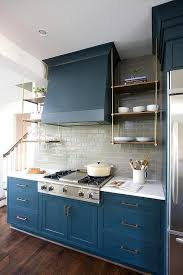 Beautiful Kitchen Features Blue Cabinets Adorned With Brass Hardware Paired With White Marble Count Kitchen Design Small Blue Kitchen Cabinets Kitchen Cabinets