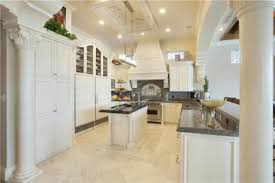 The mahogany kitchen island with its white carrara marble worktop came from fullscale woodworking inc, while the drawer unit and white oak shelves and brass brackets were all custom made. 15 Delightful Kitchen Designs With Marble Flooring For Luxurious Look