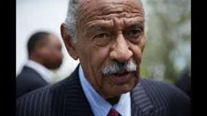 New Conyers accuser says lawmaker stripped in Washington hotel room