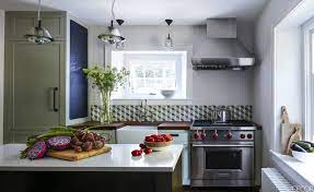The limited countertop space available smartly houses the sink, stovetop, and prepping area without making it. Small House Kitchen Design Pictures