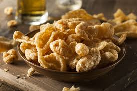The next trick is to place another baking tray on top of the pork skin for the first part of the cooking to help weigh it down. This Snack Company Makes Vegan Gluten Free Pork Rinds
