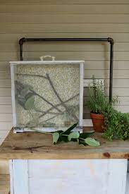 A simple butterfly enclosure you can hang on the side of your house, garage, shed or fence. Diy Monarch Habitat And Caring For Caterpillars Under A Tin Roof