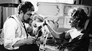 While the guests enjoy their food, the servants disappear one by one. The Exterminating Angel