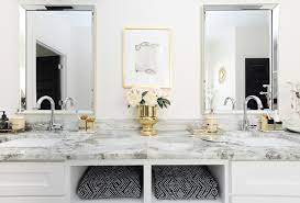 An incredible collection of 33 spectacular white primary bathrooms here. Glam Gold White Master Bathroom Refresh Monica Wants It
