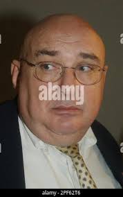 Attorney Fred Radolovich, representing Allen Dwayne Coates, 37, of  Irvington, Ky., speaks following Coates' arraignment before Jefferson  County District Judge William Ryan Thursday, July 17, 2003, in Louisville,  Ky. Ryan ordered a