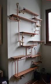 Floating wall unit 9.25 deep various width w/ three shelves. Pipe Shelves