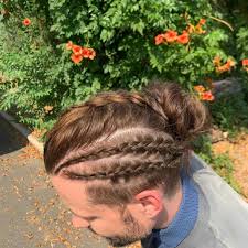 Section your hair down your center parting, then start creating two dutch braids at the nape of your neck. Best Man Bun Braids Hairstyles In 2021