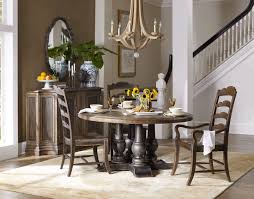 This round table includes a generous center leaf that extends it to an oval that's made for company. Dining Room Pine Tree Barn