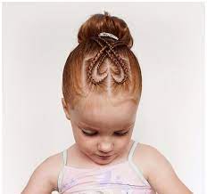 Double Heart Shapes Formed By Two Sets Of Thin Braids On Top Of A Little Ginger Girl S Hea Girly Hairstyles Cute Little Girl Hairstyles Little Girl Haircuts