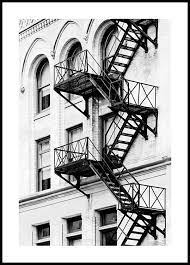 A Black And White Poster With The Image Of A Fire Escape In New York The Fire Escape Stairs Are A Classic In Fire Escape New York Fire Escape New