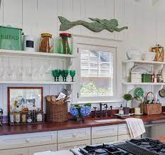 A pale shade covers the walls and ceiling while a deeper shade is used on the cabinets. Best Coastal Kitchens Get Beach Themed Kitchens Decor Ideas 2021