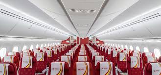 The distance between the inner sides of the armrests on a seat. Boeing 787 9
