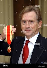 Director of Public Prosecutions, Sir David Calvert-Smith, with his  knighthood which was presented to him by the Prince of Wales at Buckingham  Palace, London Stock Photo