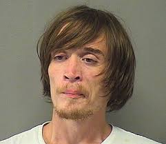 Parolee allegedly breaks windows at 3 businesses