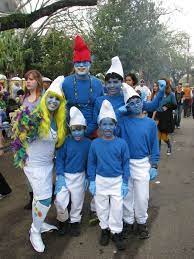 We use blue smurf face paint and makeup to transform ourselves into our favorite charers smurfette and clumsy smurf. Diy Smurf Costume Maskerix Com Family Halloween Costumes Family Halloween Smurf Costume