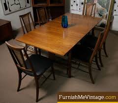 Butterfly leaf dining tables offer convenient expansion in small kitchens or dining rooms. Mid Century Modern Butterfly Leaf Dining Table