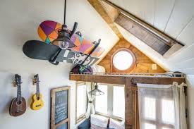 Use door stops to mount your snowboard collection on a wall. How To Store Snowboards Snowboarding Gear 7 Proven Steps