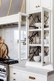 wallpaper on back of cabinet design ideas