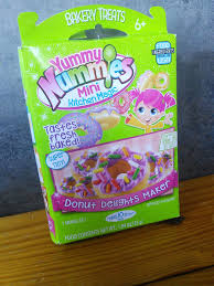 Making a yummy nummies terrific taco maker kit that forms tiny tacos complete with cheese, taco sauce, and a tiny soda on this. Mom Knows Best Yummy Nummies Mini Kitchen Magic Donut Delights Maker