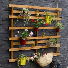 In case you were wondering how to make yourself a new coffee table on a budget or need to hide your garden hose somewhere, i've got you covered. 16 Pallet Ideas For Gardens Diy Ways To Recycle Wood Into Furniture Planters Bars Tables And More