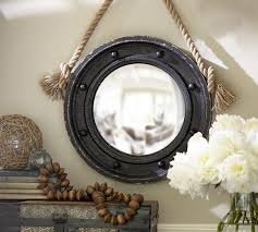 It's the perfect accent to their wall for a complete maritime look. Porthole Black Mirror