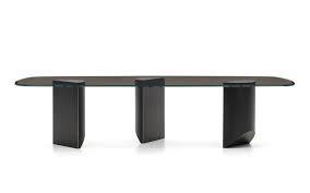 The coffee table has an extending top that lifts up to provide a footing raised work surface. Wedge Dining Tables En